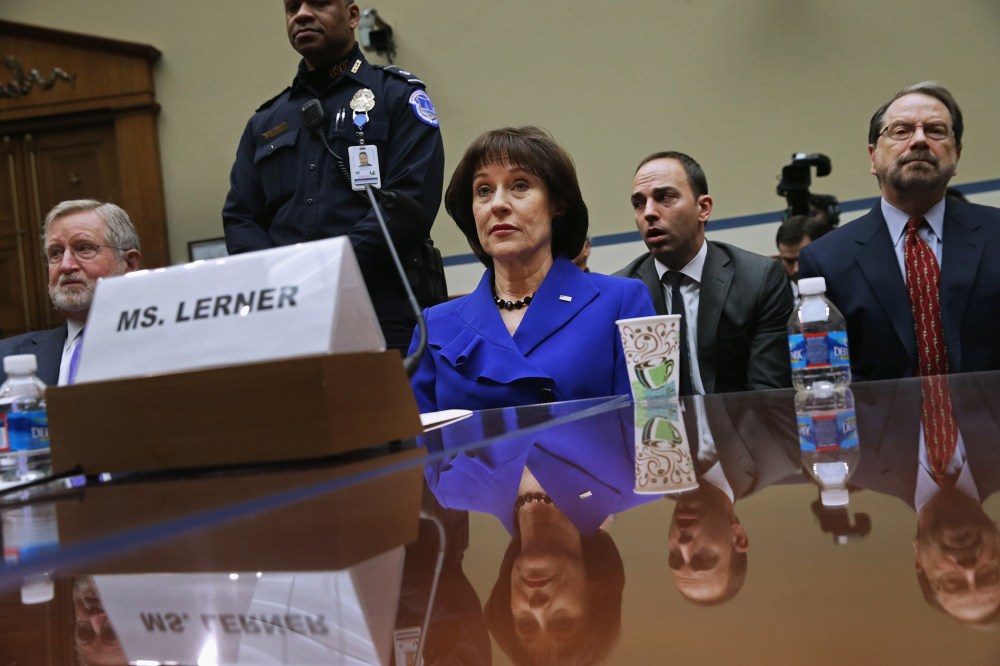Former Internal Revenue Service official Lois Lerner (C) exercises her Fifth Amendment right not to speak about the IRS targeting investigation, March 5, 2014.