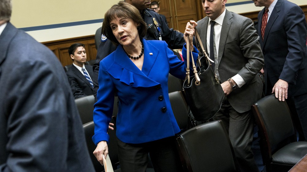 Lois Lerner leaves following a hearing of the House Oversight and Government Reform Committee, March 5, 2014.