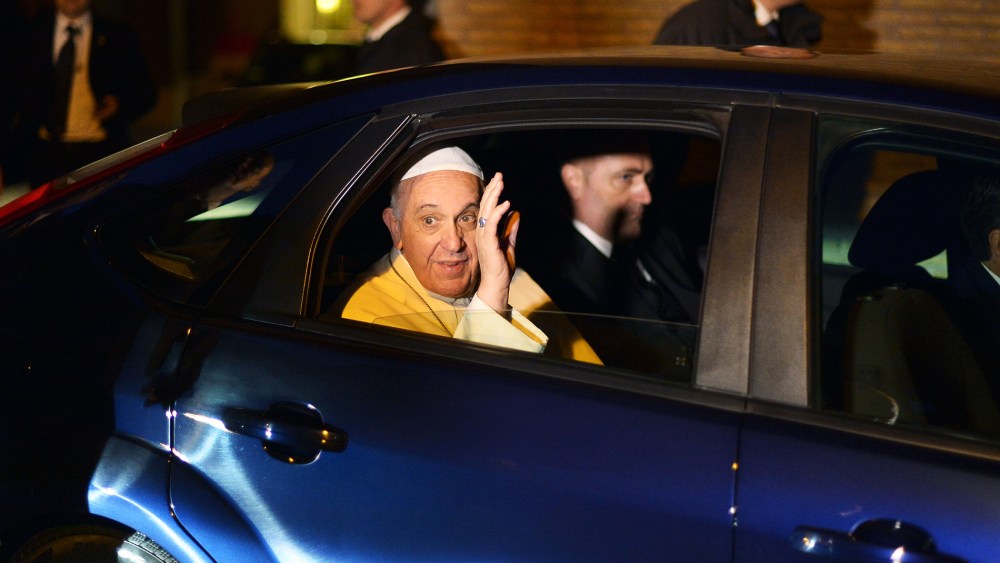 Pope Francis waves as he leaves the Santa Sabina church in Rome, March 5, 2014.