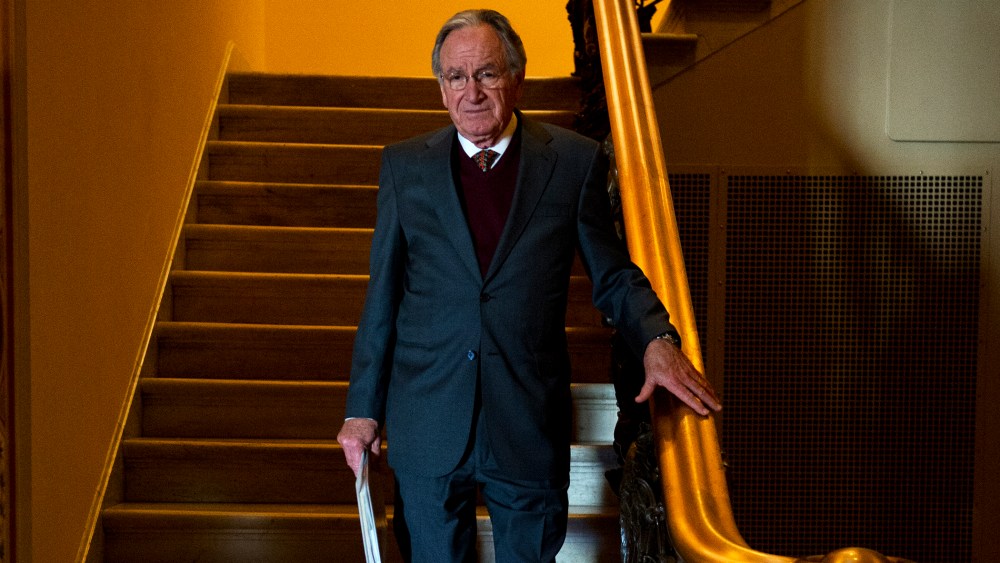 Sen. Tom Harkin descends a stairway to the first floor of the Capitol after the senate luncheons.