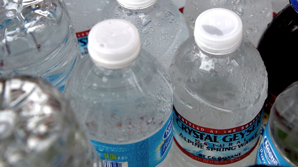 Bottles of water sit in a cooler at a hot dog stand on March 5, 2014 in San Francisco, California.