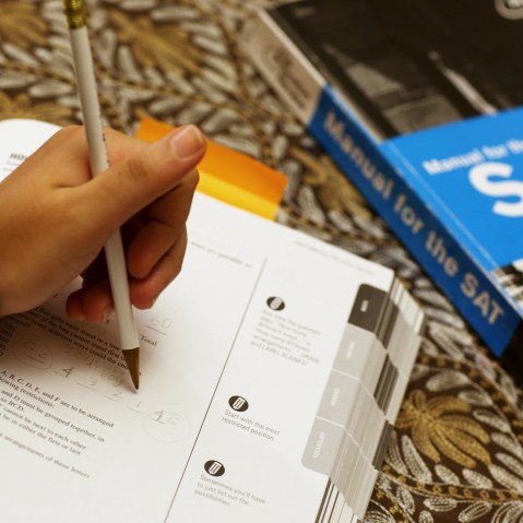 A student uses a Princeton Review SAT Preparation book to study for the test, March 6, 2014, in Pembroke Pines, Fla.
