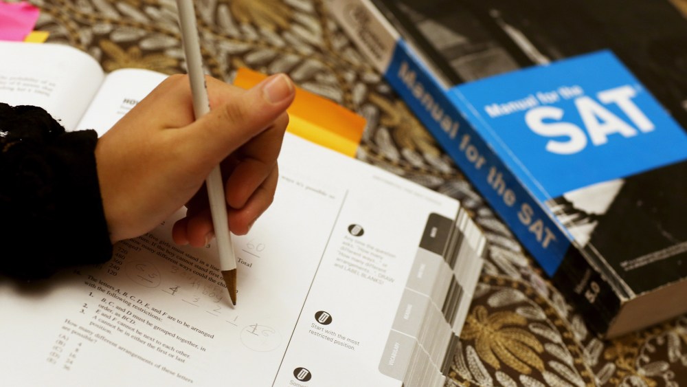 A student uses a Princeton Review SAT Preparation book to study for the test, March 6, 2014, in Pembroke Pines, Fla.