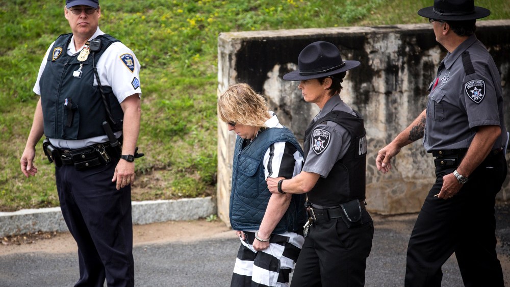 Joyce Mitchell, a prison worker who allegedly helped two convicts escape from prison, is lead from Plattsburgh Ciy Court after a hearing on June 15, 2015 in Plattsburgh, N.Y. (Photo by Andrew Burton/Getty)
