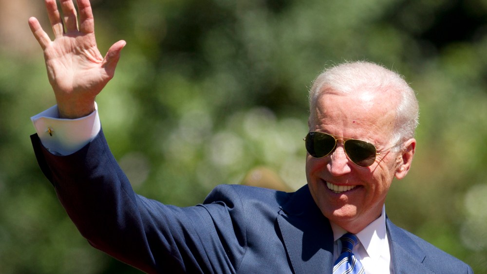 US Vice President Joe Biden waves at the press in Vina Del Mar, Chile on March 11, 2014.