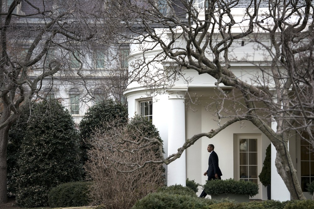 US President Barack Obama walks from the West Wing to Marine One on the South Lawn of the White House ob March 11, 2014 in Washington, DC.