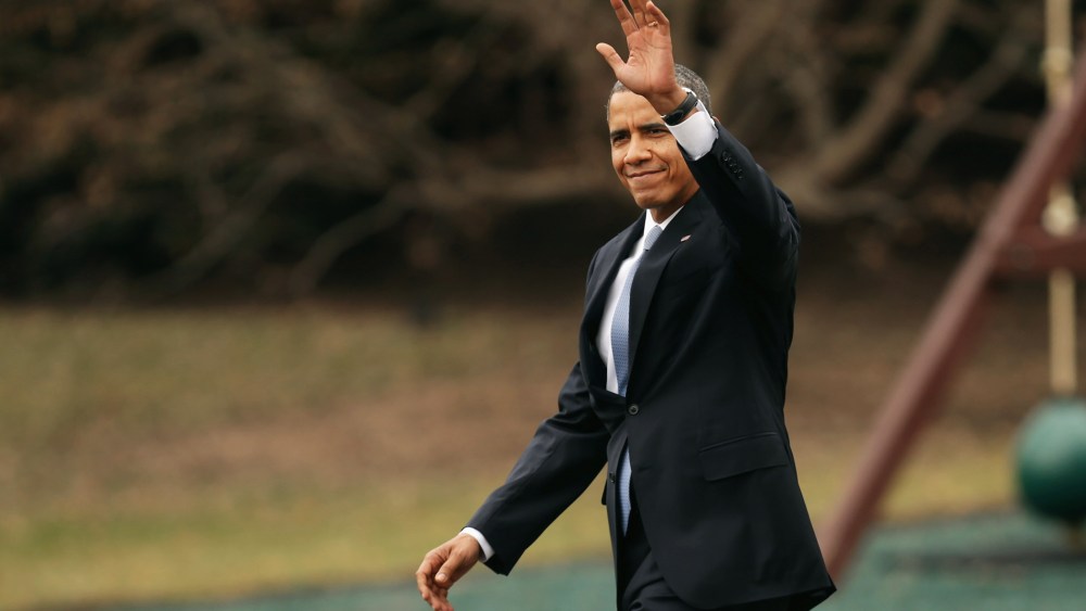 President Obama waves to guests as he walks across the South Lawn, March 11, 2014.