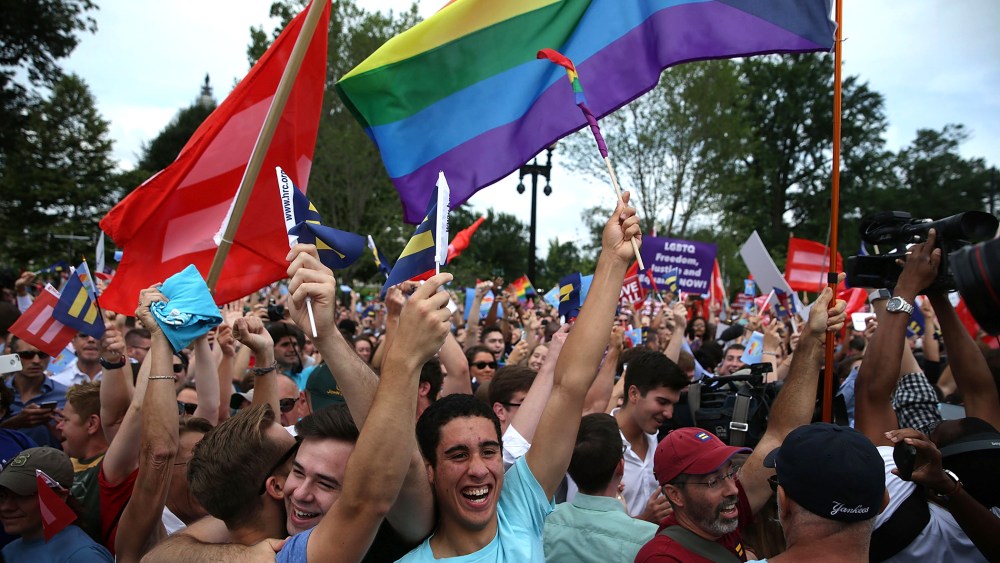 Same-sex marriage supporters rejoice after the U.S Supreme Court hands down a ruling regarding same-sex marriage June 26, 2015 outside the Supreme Court in Washington, D.C. (Photo by Alex Wong/Getty)