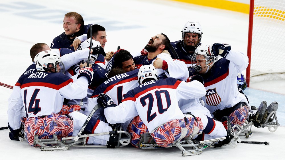 Team USA celebrates winning the Ice Sledge Hockey Gold Medal match between Russia and USA at the Shayba Arena during day eight of the 2014 Paralympic Winter Games on March 15, 2014 in Sochi, Russia.