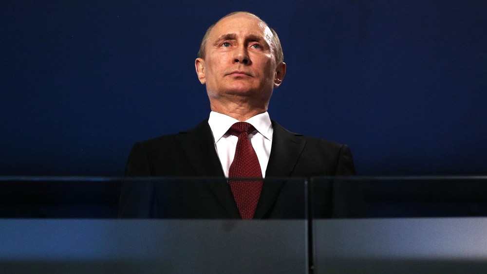 Russian President Vladimir Putin watches the Sochi 2014 Paralympic Winter Games Closing Ceremony, March 16, 2014 in Sochi, Russia.