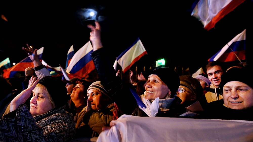 Pro-Russian supporters attend a rally in Lenin Square after a day of voting on March 16, 2014 in Simferopol, Ukraine.