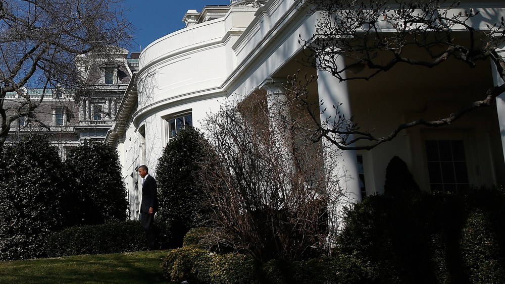 President Barack Obama walks from the Oval Office of the White House to deliver a statement, March 20, 2014.