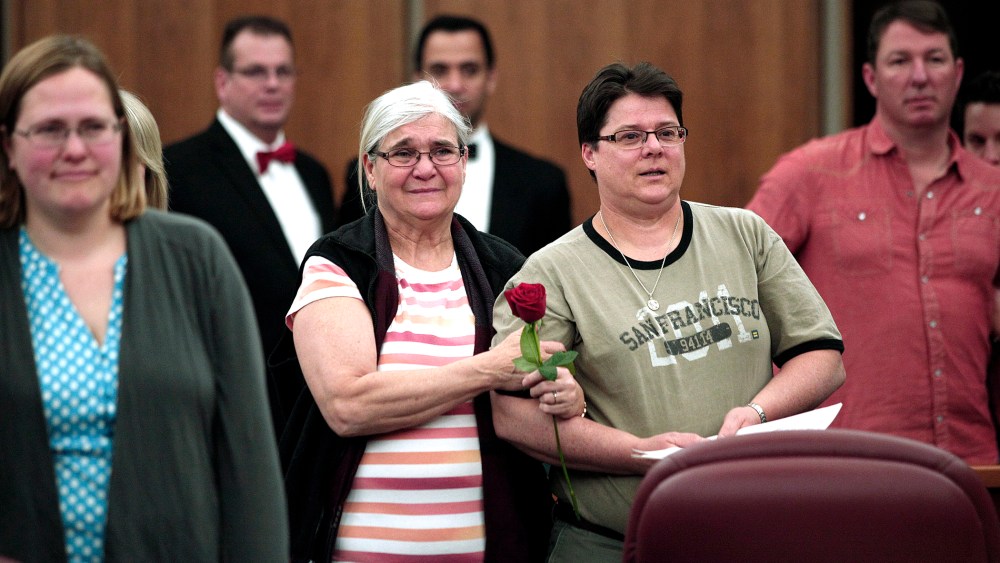 Same-sex couples get married in a group ceremony at the Oakland County Courthouse on March 22, 2014 in Pontiac, Mich.