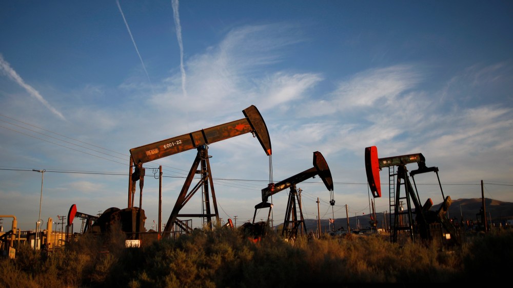 Pump jacks and wells are seen in an oil field where gas and oil extraction uses hydraulic fracturing, or fracking.