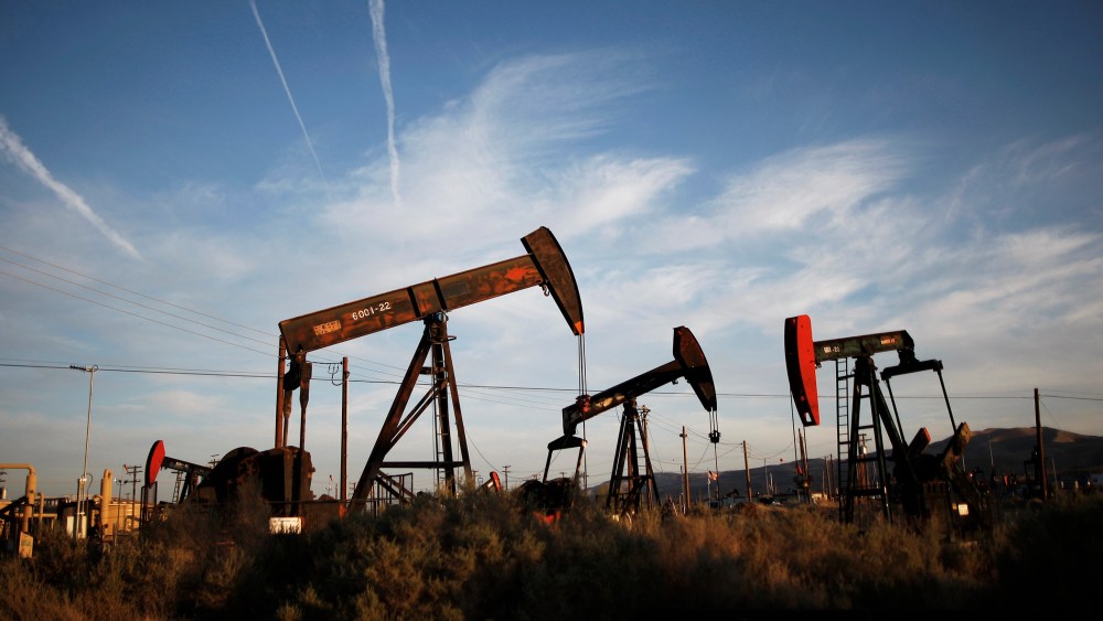 Pump jacks and wells are seen in an oil field on the Monterey Shale formation where gas and oil extraction using hydraulic fracturing, or fracking, is on the verge of a boom on March 23, 2014 near McKittrick, Calif. (Photo by David McNew/Getty)