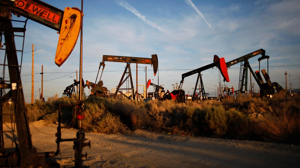 Pump jacks and wells are seen in an oil field on the Monterey Shale formation where gas and oil extraction using hydraulic fracturing, or fracking, is on the verge of a boom on March 23, 2014 near McKittrick, Calif. (Photo by David McNew/Getty)