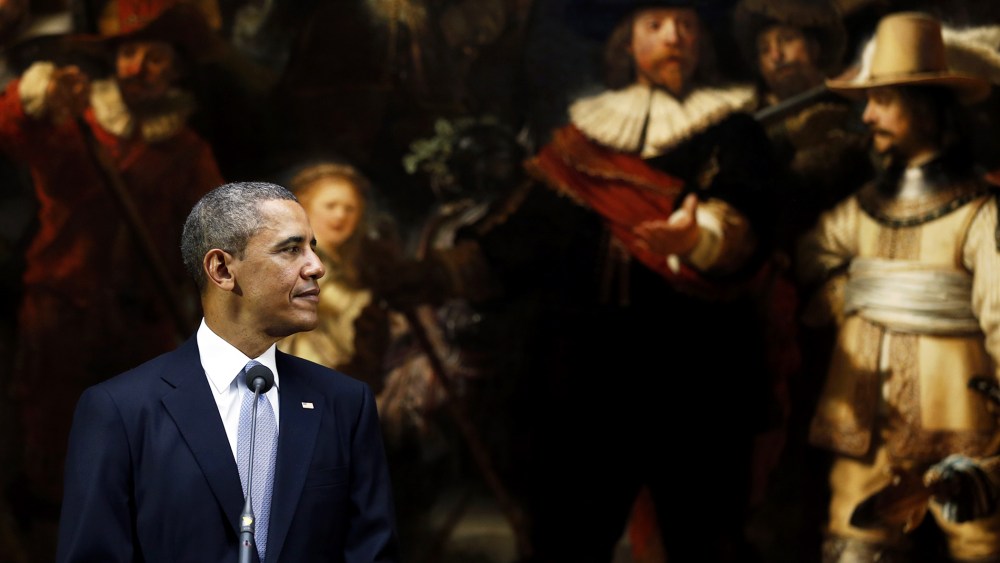 President Barack Obama looks over at the Dutch Prime Minister during a joint press conference held in front of Rembrandt's painting "The Night Watch"