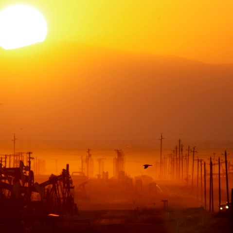 The sun rises over an oil field over the Monterey Shale formation on March 24, 2014 near Lost Hills, Calif.