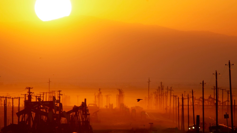 The sun rises over an oil field over the Monterey Shale formation on March 24, 2014 near Lost Hills, Calif.