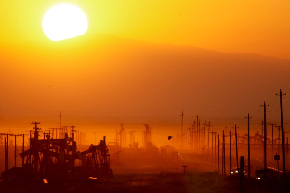 The sun rises over an oil field over the Monterey Shale formation on March 24, 2014 near Lost Hills, Calif.