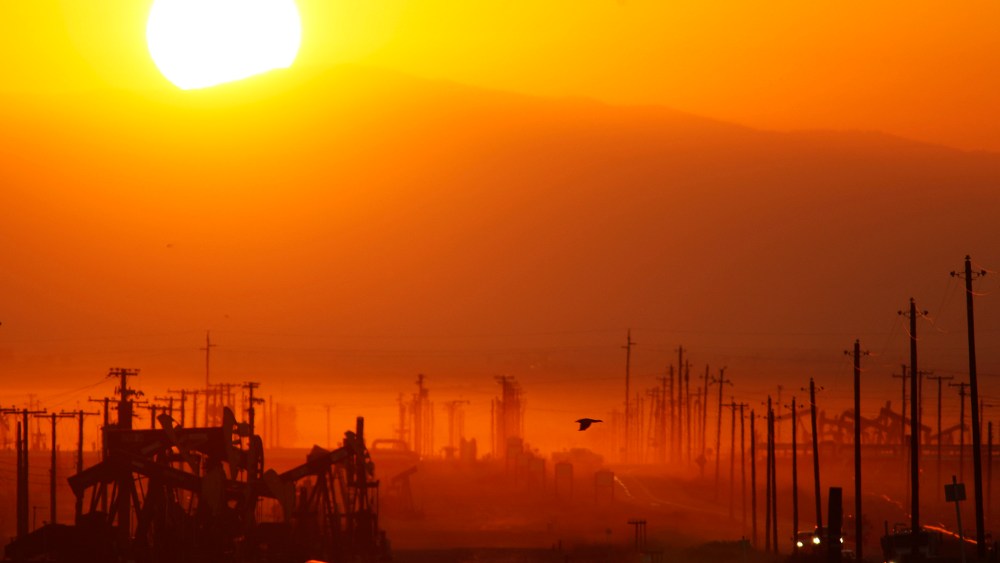 The sun rises over an oil field over the Monterey Shale formation where gas and oil extraction using hydraulic fracturing, or fracking, is on the verge of a boom on March 24, 2014 near Lost Hills, Calif.
