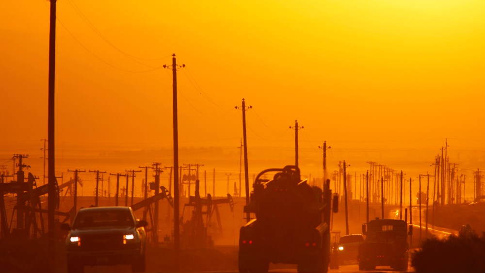 Traffic near an oil field over the Monterey Shale formation, where gas and oil extraction using hydraulic fracturing is on the verge of a boom, near Lost Hills, California, March 24, 2014.