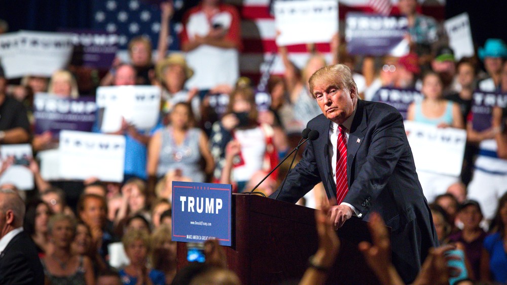 Republican Presidential candidate Donald Trump addresses supporters during a political rally at the Phoenix Convention Center on July 11, 2015 in Phoenix, Ariz. (Photo by Charlie Leight/Getty)