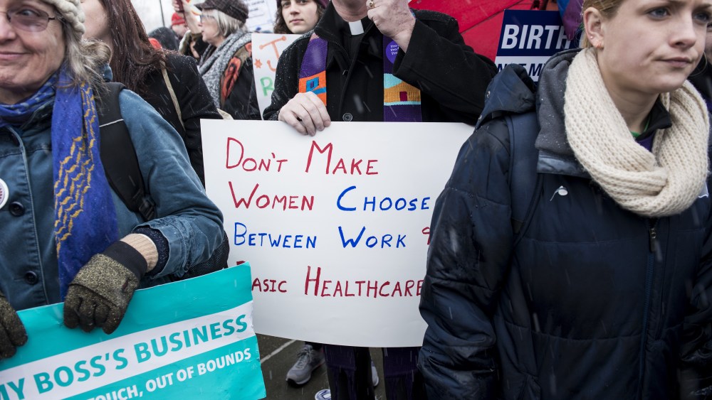 Activists rally outside the Supreme Court March 25, 2014 in Washington, DC.