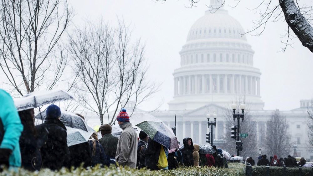 People stand outside the US Supreme Court, Mar. 25, 2014.
