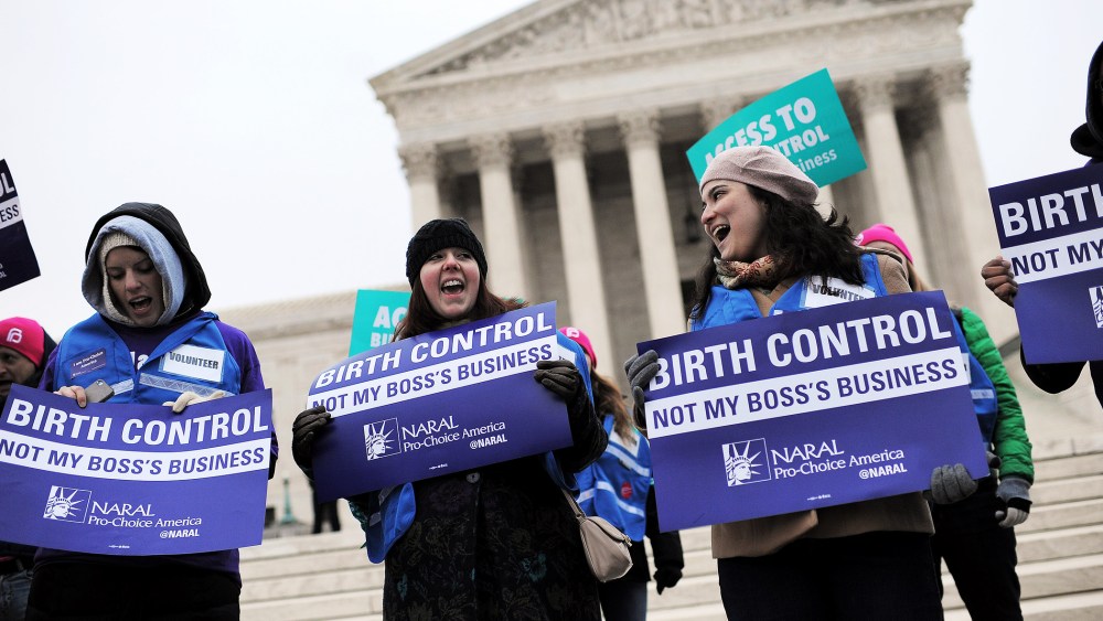 Demonstrators rally while the Supreme Court hears arguments on aspects of the Affordable Care Act involving a mandate for contraception, March 25, 2014.