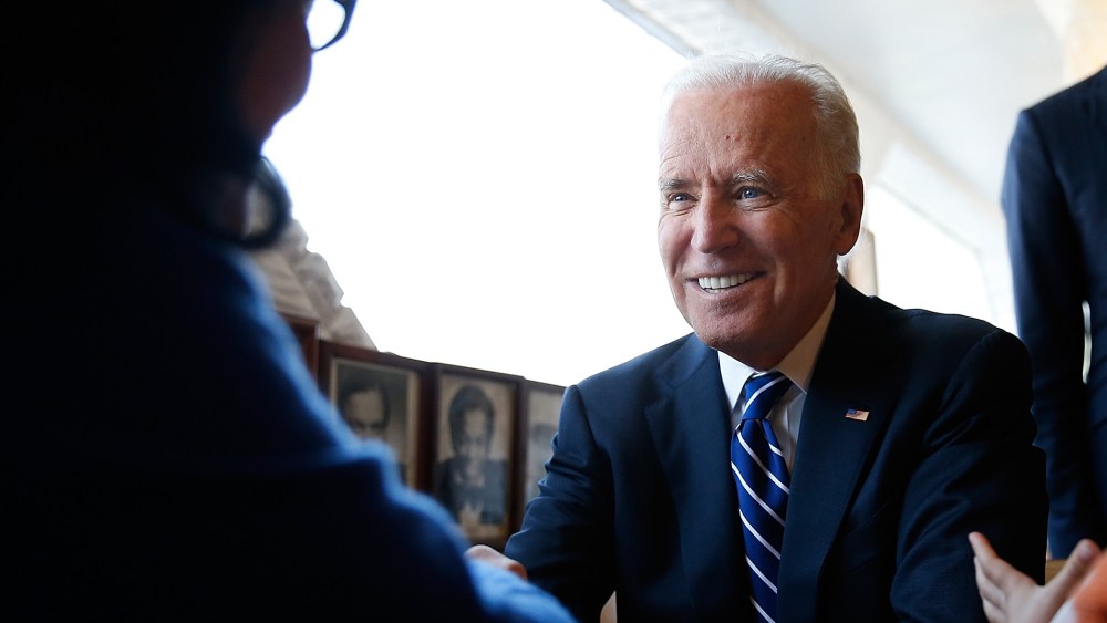 U.S. Vice President Joe Biden sits with customers while visiting the Florida Avenue Grill March 26, 2014 in Washington, DC.