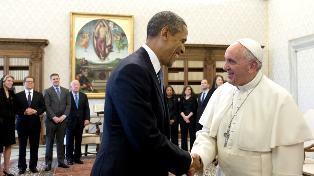 Pope Francis (R) and US President Barack Obama shake hands during a private audience on March 27, 2014 at the Vatican.