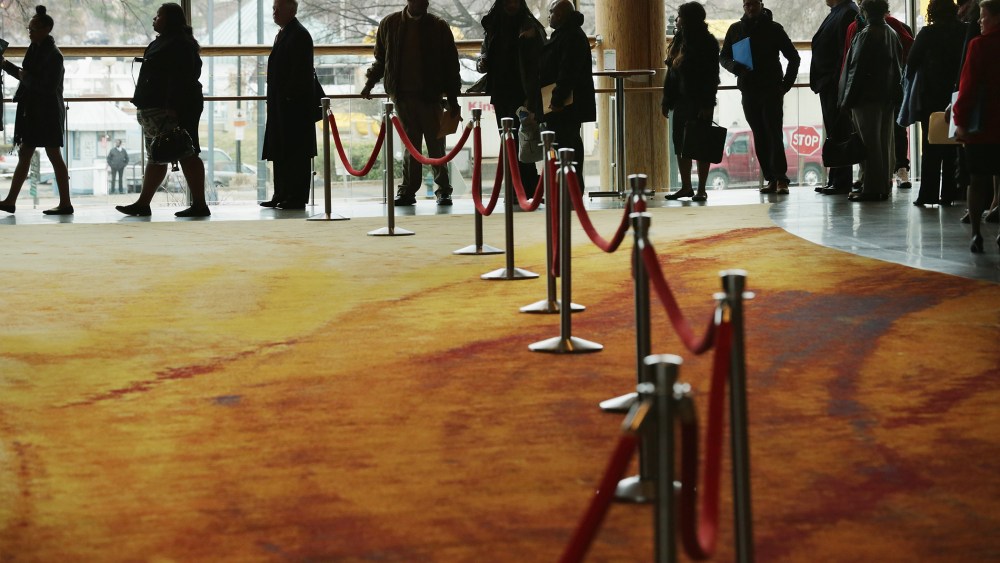 About 1,500 people seeking employment wait in line to enter a job fair, March 28, 2014 in Washington, DC.