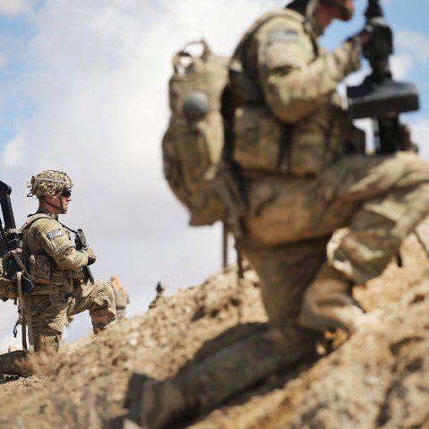 Sgt. Nathan Harrell with the U.S. Army's 2nd Battalion 87th Infantry Regiment, 3rd Brigade Combat Team, 10th Mountain Division, patrols on the edge of a village near Pul-e Alam, Afghanistan on March 29, 2014. (Photo by Scott Olson/Getty)