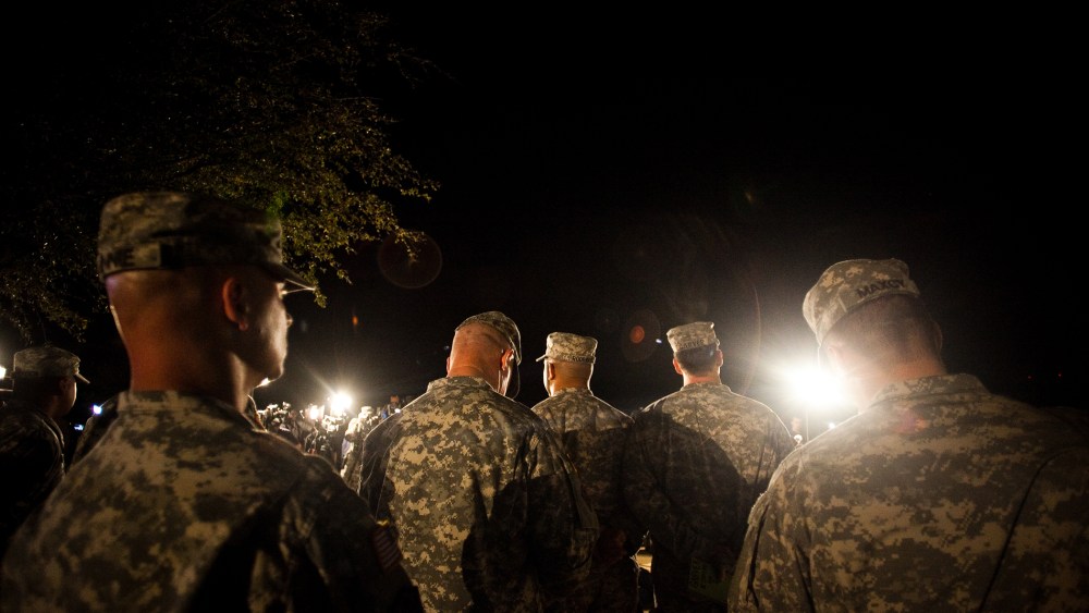 Soldiers watch during a press conference about a shooting that occurred earlier in the day at Fort Hood Military Base on April 2, 2014.