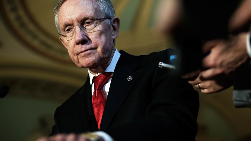 Harry Reid (D-NV) speaks with reporters following the weekly policy luncheon for Senate Democrats April 8, 2014.