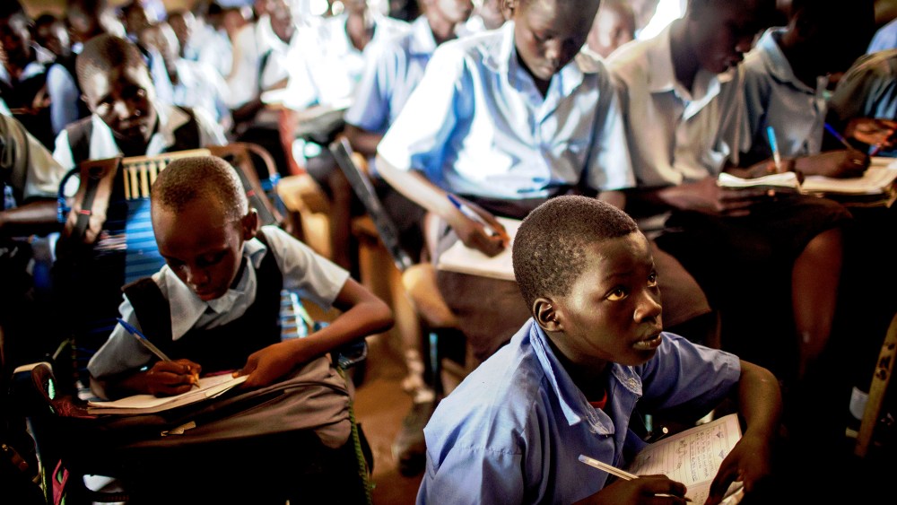Students take notes during an English language class at the Juba Nabari Primary School, in Juba on April 9, 2014.