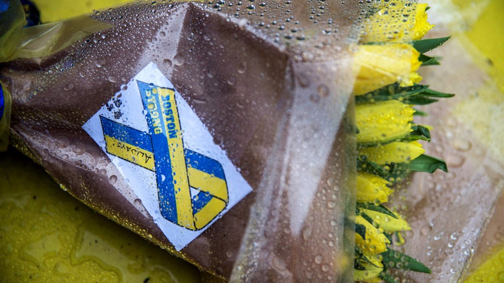 Flowers lie on the finish line of the Boston Marathon on the one year anniversary of the 2013 Boston Marathon Bombing, on April 15, 2014 in Boston, Mass.