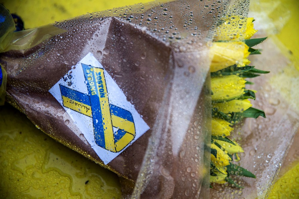 Flowers lie on the finish line of the Boston Marathon on the one year anniversary of the 2013 Boston Marathon Bombing, on April 15, 2014 in Boston, Mass.