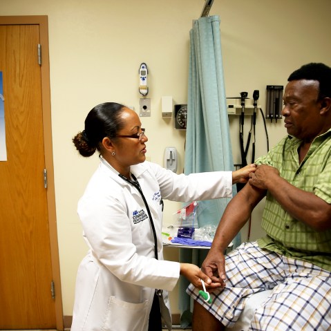 Felue Chang who is newly insured under a plan through the Affordable Care Act receives a checkup at the South Broward Community Health Services clinic in Hollywood, Fla., April 15, 2014.