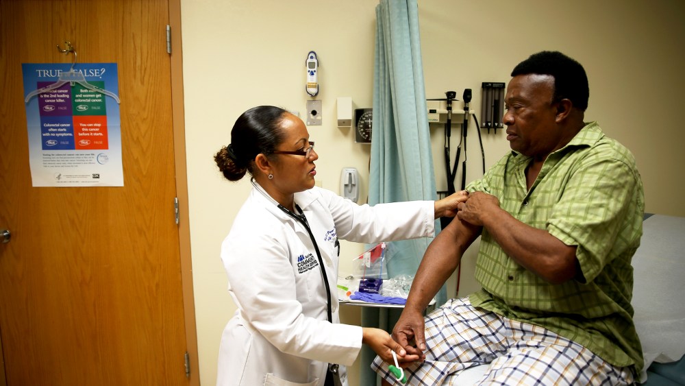 Felue Chang who is newly insured under a plan through the Affordable Care Act receives a checkup at the South Broward Community Health Services clinic in Hollywood, Fla., April 15, 2014.