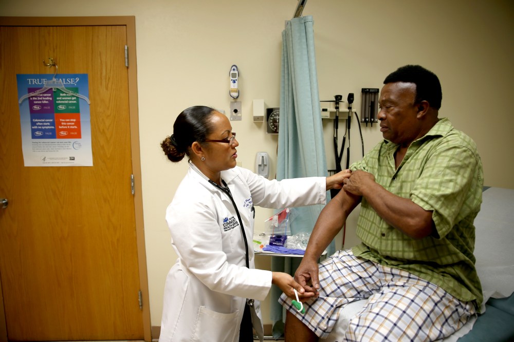Felue Chang, who is newly insured through the Affordable Care Act, receives a checkup, April 15, 2014 in Hollywood, Florida.
