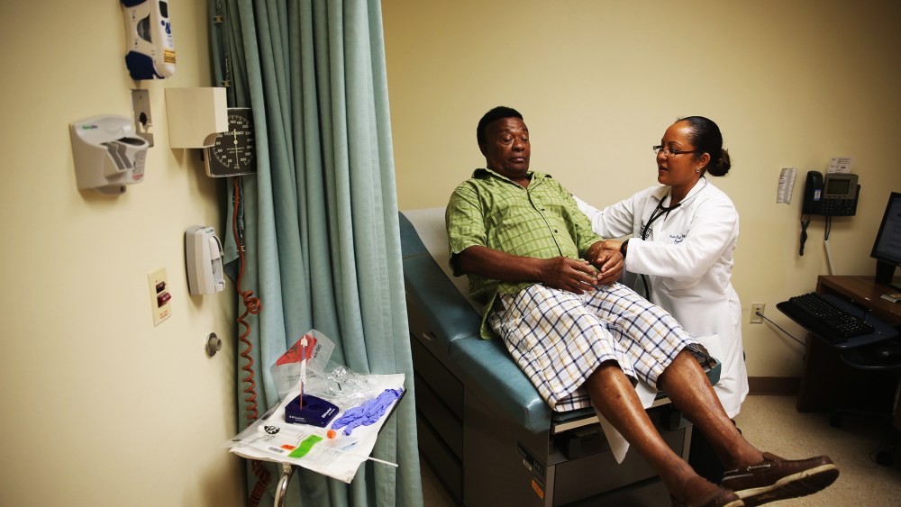 Felue Chang, who is newly insured under an insurance plan through the Affordable Care Act, receives a checkup,  April 15, 2014 in Hollywood, Florida.