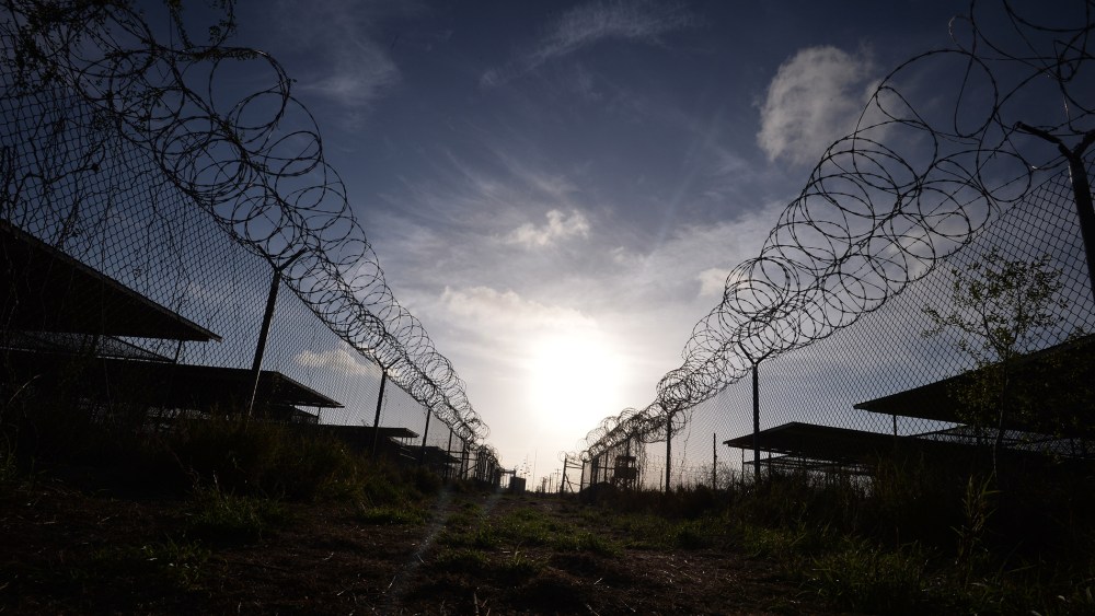 This photo made during an escorted visit and reviewed by the US military, shows the razor wire-topped fence at the abandoned "Camp X-Ray" detention facility at the US Naval Station in Guantanamo Bay, Cuba, April 9, 2014. (Photo Mladen Antonov/AFP/Getty)