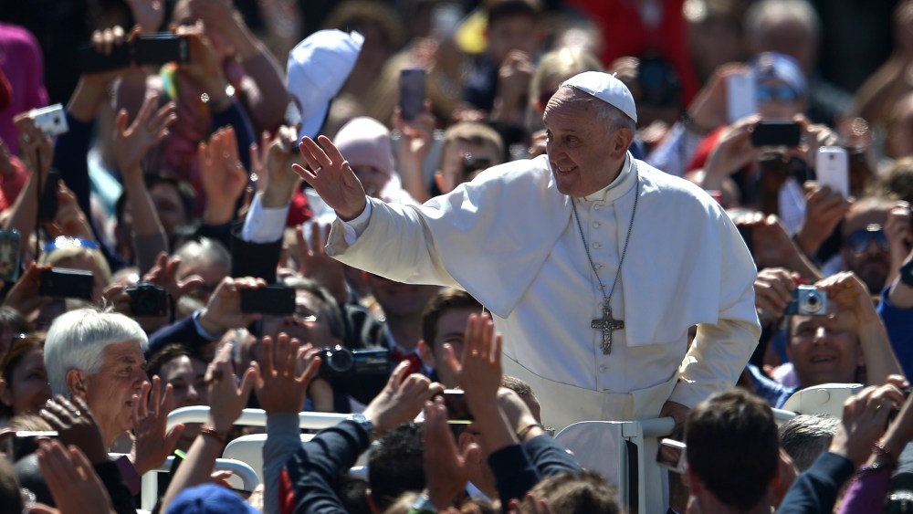 Pope Francis greets the crowd after the Easter mass on April 20, 2014 at St Peter's square in Vatican.