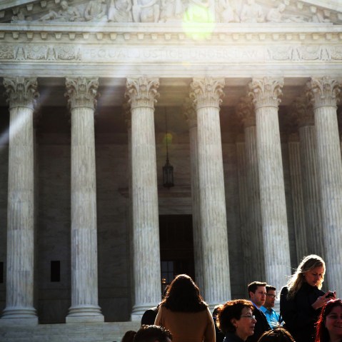 People wait in-line to enter the U.S. Supreme Court to hear oral arguments April 22, 2014 in Washington, DC.