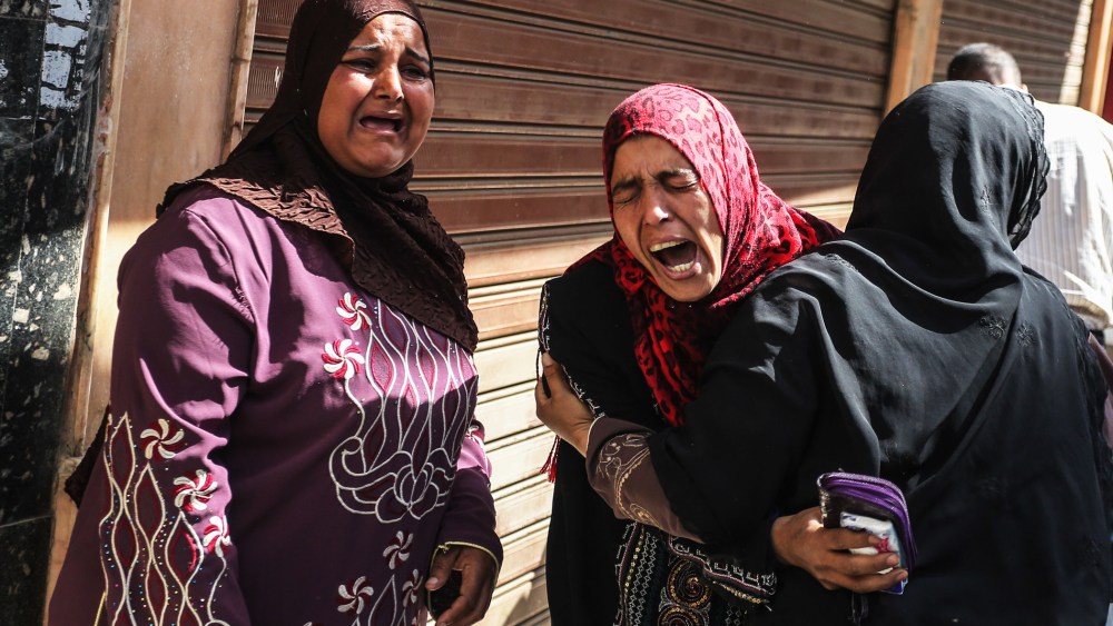 Egyptian defendants' relatives mourn after a judge sentenced 683 alleged Morsi backers to death in the latest mass trial in the southern city of Minya, Egypt, April 28, 2014.