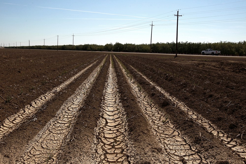 Dried and cracked earth on an unplanted field at a farm on April 29, 2014 near Mendota, California.