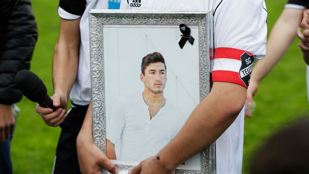 Team-mates, friends and relatives gather to remember Diren Dede at his football club, SC Teutonia 1910, on April 30, 2014 in Hamburg, Germany.
