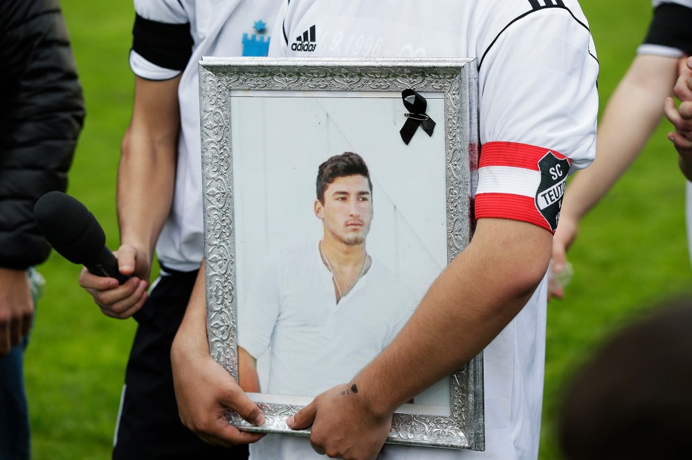 Team-mates, friends and relatives gather to remember Diren Dede at his football club, SC Teutonia 1910, on April 30, 2014 in Hamburg, Germany.